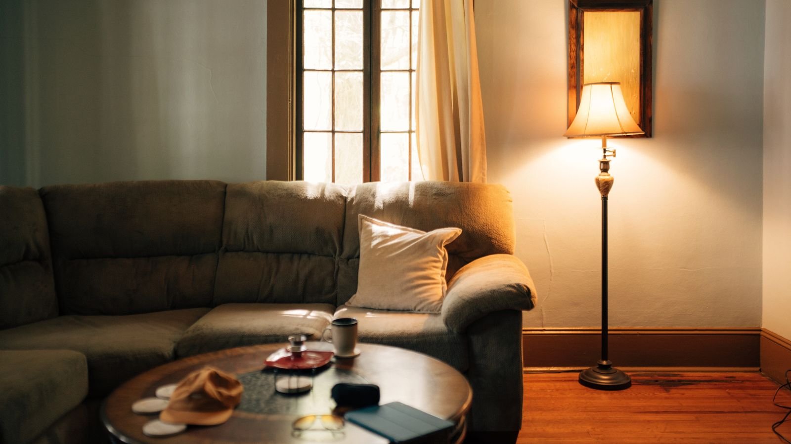 A wide view of a warm, inviting living room with a sofa and coffee table